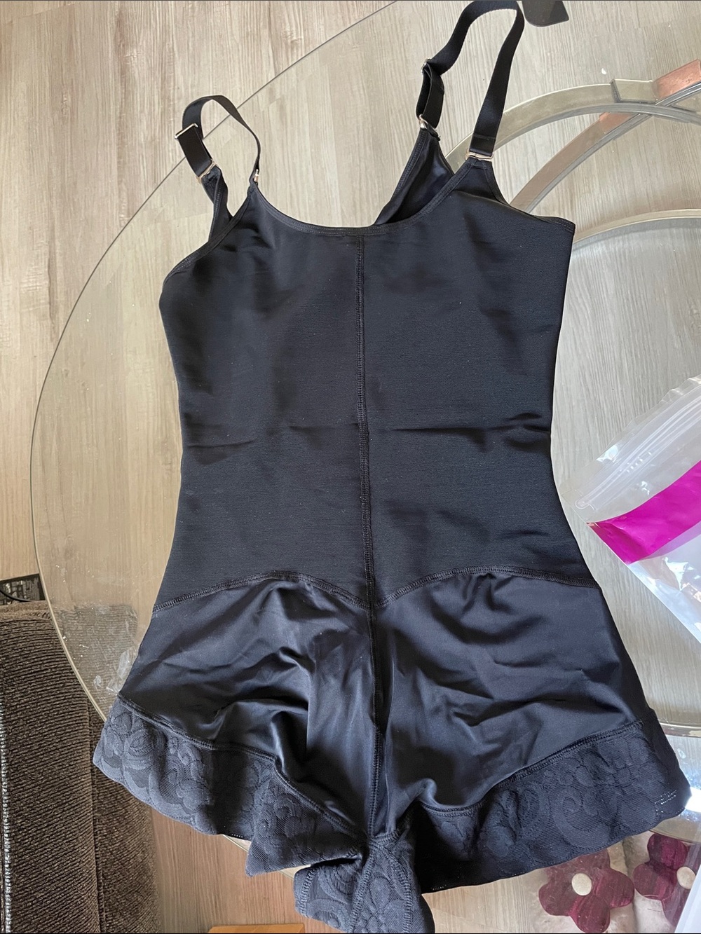 Sleek Black Shaping Bodysuit with Lace Hem